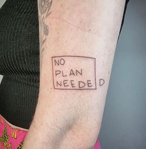 Small lettering quote tattoo by artist Jonathan Glick on arm in a square design