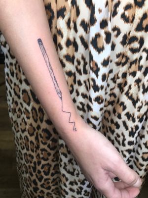 Get edgy with this illustrative pencil tattoo by Jonathan Glick. Perfect for artsy souls seeking a bold statement.