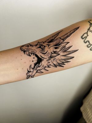 Experience the power of this illustrative dragon tattoo by renowned artist Jonathan Glick. Bold lines and vibrant colors bring this legendary creature to life on your skin.