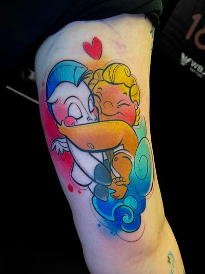 Vibrant watercolor tattoo of baby Hercules and Pegasus by Cloto.tattoos. Perfect for any Disney fan!