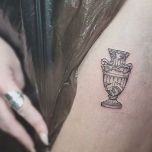 Capture the beauty of nature with this intricate vase tattoo designed by renowned artist Jonathan Glick. Perfect for those who appreciate art and flora.