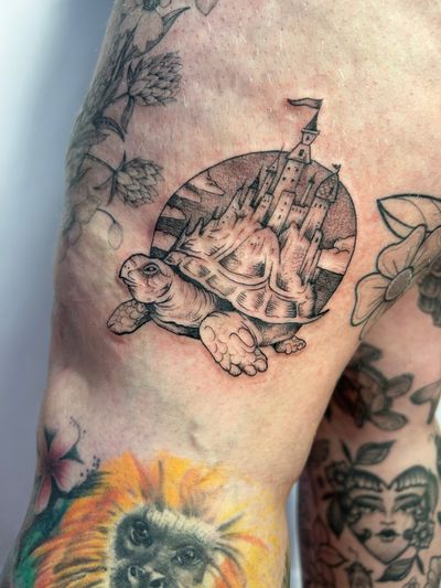 Get a breathtaking dotwork tattoo of a turtle and castle inspired by Mont Saint Michel, expertly crafted by Jonathan Glick.