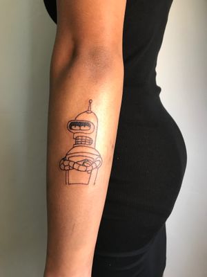 Get inked with Jonathan Glick's fine line, illustrative Bender tattoo from Futurama. Show off your love for this iconic character!