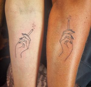 Ignorant style tattoo featuring a hand holding a cigarette, perfect for a rebellious look. By Jonathan Glick.