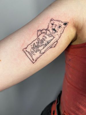 Express your love for felines and chocolate with this playful and unique illustrative tattoo by Jonathan Glick.