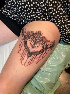 Experience a unique blend of ornamental and illustrative styles in this stunning heart tattoo by the talented artist Frankie Brown.