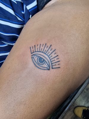 Get a unique illustrative design of the evil eye by the talented artist Iva M, to ward off negative energy with style.