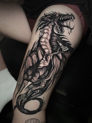 Bold blackwork tattoo featuring a fierce wyvern dragon, by renowned artist Kike Krebs. Captivating and intricate design.