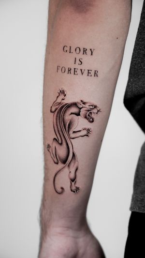 Embrace your inner strength with this captivating black and gray panther tattoo by Jacky Yang. Perfect for a bold and fearless look.