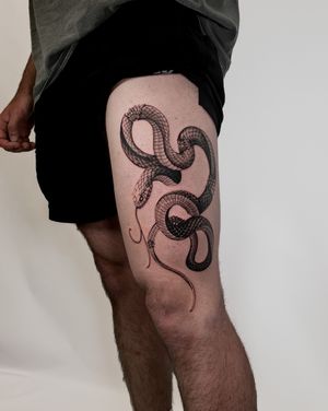 Capture the mystique & allure with a snake motif inked by the skilled hands of Jacky Yang. Perfect for thigh placement.