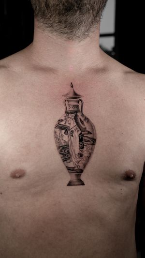 Experience intricate detail and artistry with this stunning vase tattoo on the sternum by the talented artist Jacky Yang.