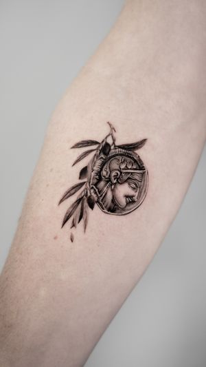 Experience the intricate detail of this lucky penny tattoo on your forearm, featuring a coin and Athena in a micro realism style by the talented artist Jacky Yang.