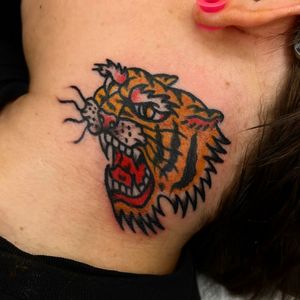 Check out this fierce traditional tiger tattoo by Alessandro Lanzafame, perfect for your neck!