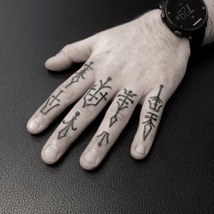 Unique illustrative finger tattoo featuring intricate pattern by artist Oliver Whiting.