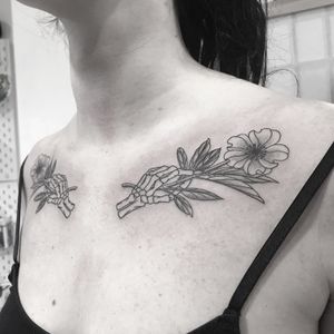 Unique dotwork design by Oliver Whiting featuring hands holding a flower intertwined with a skeleton motif.