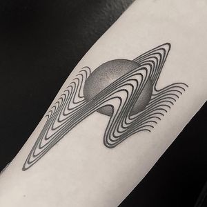 Explore the mesmerizing blend of black and gray, dotwork, and geometric lines in this wavy illustrative tattoo by the talented Oliver Whiting.