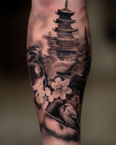 Beautiful black and gray tattoo featuring mountains, orchids, pagoda, and birds, by Abel Lopez.