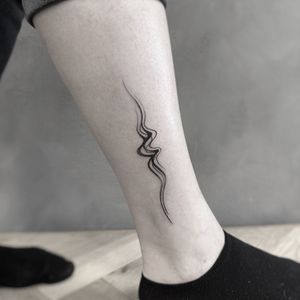 Experience the beauty of flow and wavy lines with this stunning watercolor tattoo by the talented artist, Oliver Whiting.