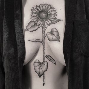 Unique dotwork design of a sunflower by tattoo artist Oliver Whiting. Perfect for nature lovers and botanical enthusiasts.