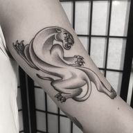 A stunning dotwork panther tattoo combining illustrative and traditional styles by renowned artist Oliver Whiting.