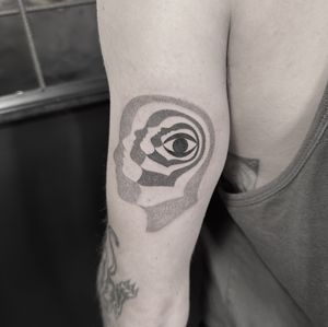 Experience the mesmerizing blend of dotwork and surrealism with this abstract eye motif tattoo by the talented artist Oliver Whiting.