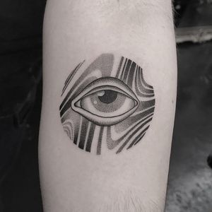 Experience Oliver Whiting's intricate design of flowing wavy lines in this mesmerizing blackwork and dotwork eye tattoo.