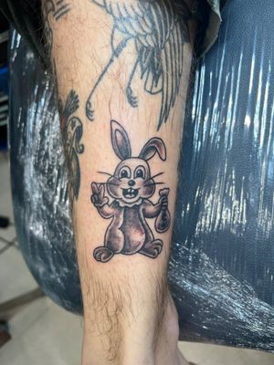 Get a unique and playful bunny tattoo in the ignorant style by talented artist Clayton Jeremiah. Stand out from the crowd with this one-of-a-kind design!