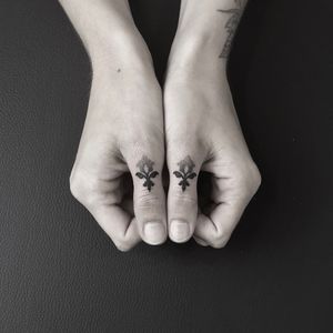 Unique thumb tattoo design in intricate dotwork style by Oliver Whiting. Incorporates ornamental elements for a stylish look.