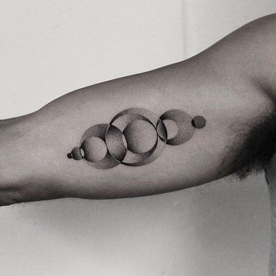 Experience the intricate beauty of dotwork in this geometric circle tattoo by acclaimed artist Oliver Whiting.