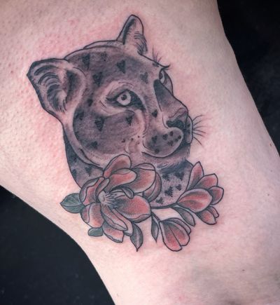 Get a unique and eye-catching tattoo featuring a leopard and flower design, expertly done by Nat in neo-traditional style!
