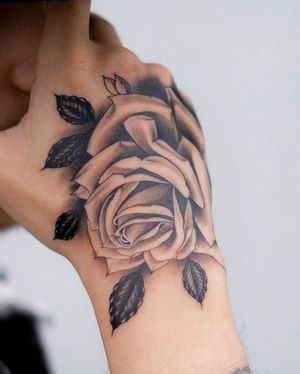 Capture the beauty of a rose in this stunning black and gray illustrative tattoo by Ion Caraman.