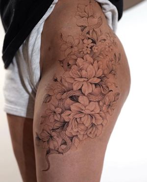 Beautiful floral design with a slithering snake, expertly done by Ion Caraman. Perfect for a daring yet delicate look. 