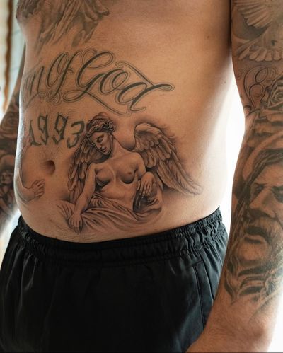 Capture the beauty and grace of an angel statue with this stunning black and gray realism tattoo by Ion Caraman.