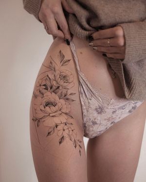 Elegant and intricate floral design on the hip by talented artist Ion Caraman. Perfect for a touch of nature and beauty.