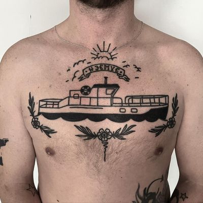 This traditional style tattoo by Rasmus Bang features a detailed design of a ship and boat with a patchwork motif.