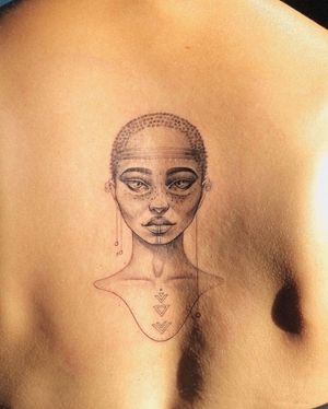 Beautiful black and gray tattoo of an African woman created by Ion Caraman, featuring intricate fine line details.