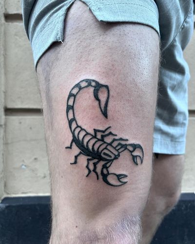 A bold blackwork scorpion tattoo designed by Rasmus Bang in a traditional style.