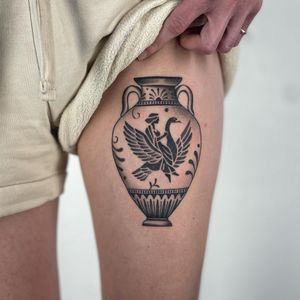 Experience a blend of ancient Greek artistry and modern tattoo techniques with this dotwork vase tattoo by renowned artist Paula.