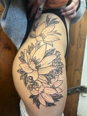 Beautiful and detailed lily flower tattoo design, artistically created by the talented Claudia Vicente. A timeless piece of floral art.