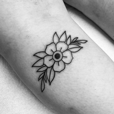 Capture the beauty of nature with this traditional style sakura flower tattoo designed by Claudia Vicente.