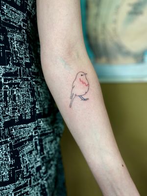 Charlotte Pokes unique design of a bird in an ignorant style for a bold and striking forearm tattoo.