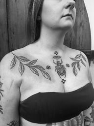 Claudia Vicente's unique design features a scarab, branch, and evil eye motif in vibrant illustrative style. Stand out from the crowd with this stunning tattoo.