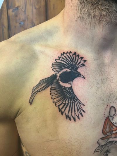 Beautiful illustrative tattoo of a magpie bird by artist Claudia Vicente.