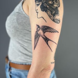 Get inked with a unique dotwork style swallow tattoo by the talented artist Paula. Symbol of freedom and loyalty.