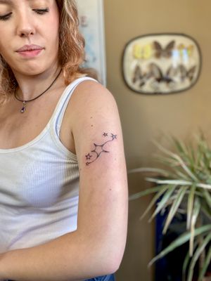 Beautiful star motif tattoo created with delicate dotwork and fine lines, hand poked by the talented Charlotte Pokes.