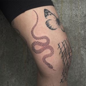 Experience the serpentine beauty with this illustrative snake tattoo created by the talented artist Rich Sinner.