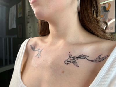 Exquisite illustrative tattoo of a koi fish, expertly done with fine line technique by talented artist, Claudia Vicente.