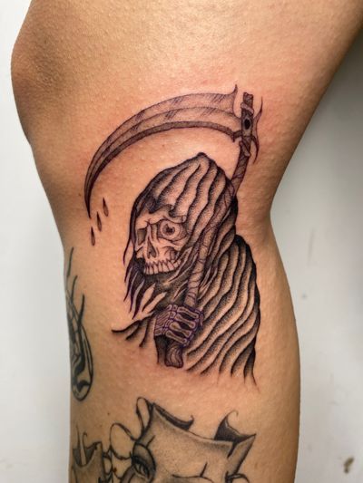 Embrace the darkness with this striking illustrative tattoo by Charlie Macarthur. A hauntingly beautiful design featuring the iconic grim reaper.