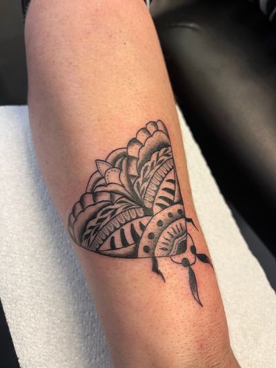 Beautifully detailed tattoo featuring a moth and intricate pattern by artist Claudia Vicente. Express your unique style with this illustrative design.