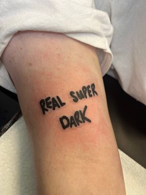 Get a stunning and powerful lettering tattoo with a real super dark quote, expertly done by artist Claudia Vicente.
